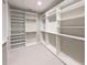 Large walk-in closet with organized shelving and hanging rods, maximizing storage potential at 16210 Ravenna Ct, Montverde, FL 34756