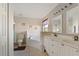 Bright bathroom featuring a bathtub with tile surround, double sink vanity, and neutral walls at 1956 Southern Dunes Blvd, Haines City, FL 33844