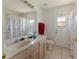 Bathroom featuring a single sink vanity, toilet, and a shower with a privacy curtain at 1956 Southern Dunes Blvd, Haines City, FL 33844
