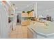 Bright kitchen with tile floors, white appliances, and plenty of counter space at 1956 Southern Dunes Blvd, Haines City, FL 33844