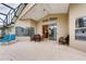 Relaxing outdoor patio with comfortable seating and a screened enclosure at 1956 Southern Dunes Blvd, Haines City, FL 33844