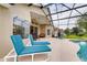 Inviting pool area with lounge chairs and a fully screened enclosure at 1956 Southern Dunes Blvd, Haines City, FL 33844