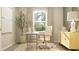 Comfortable home office setup with a white desk, ergonomic chair, and a calming view from the window at 2099 Stake Out Way, Apopka, FL 32703