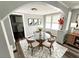 Cozy dining room with a glass table, modern chairs, and decorative accents at 2107 Hollywood Ave, Eustis, FL 32726