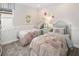 Charming bedroom decorated with twin beds and floral accents at 2320 Salty Winds Way, Kissimmee, FL 34747