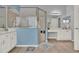 Bathroom with double sinks, walk in shower, tile floors and a separate vanity at 25105 Laurel Valley Rd, Leesburg, FL 34748