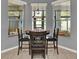 Cozy breakfast nook featuring a round table and three windows with natural light at 25105 Laurel Valley Rd, Leesburg, FL 34748