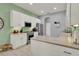 Bright kitchen featuring white cabinets, stainless steel appliances, and tile flooring at 25105 Laurel Valley Rd, Leesburg, FL 34748