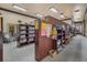 Community library featuring bookshelves filled with books, providing a quiet reading space at 25105 Laurel Valley Rd, Leesburg, FL 34748