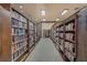 A long view of the library featuring rows of bookshelves filled with books, for residents to enjoy at 25105 Laurel Valley Rd, Leesburg, FL 34748