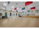 Spacious recreation room with wood floors, windows, and ample lighting provides a versatile space for community activities at 25105 Laurel Valley Rd, Leesburg, FL 34748