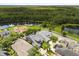 Picturesque aerial view of the property nestled near a tranquil lake and lush green spaces at 3363 Morelyn Crest Cir, Orlando, FL 32828