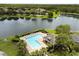 Panoramic aerial shot of the community pool area and lake at 3363 Morelyn Crest Cir, Orlando, FL 32828