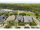 Gorgeous aerial view showcasing the property's proximity to a serene lake and surrounding landscape at 3363 Morelyn Crest Cir, Orlando, FL 32828