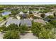 Stunning aerial view of the neighborhood with a beautiful lake and lush greenery at 3363 Morelyn Crest Cir, Orlando, FL 32828
