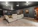 Home theater with a large screen, comfortable seating, and dim lighting at 3363 Morelyn Crest Cir, Orlando, FL 32828