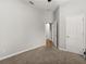Carpeted bedroom features a closet, ceiling fan and access to other areas of the home at 3363 Morelyn Crest Cir, Orlando, FL 32828