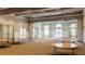 Spacious community room with light-colored walls, round tables, and large windows for natural light at 3363 Morelyn Crest Cir, Orlando, FL 32828