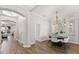Elegant dining room featuring modern chandelier, stylish decor, and wood flooring at 3363 Morelyn Crest Cir, Orlando, FL 32828