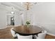 Beautiful dining room with modern chandelier and wood flooring at 3363 Morelyn Crest Cir, Orlando, FL 32828