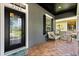Cozy front porch with seating area, decorative door, and brick flooring at 3363 Morelyn Crest Cir, Orlando, FL 32828
