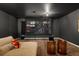 Spacious home theater features a large screen, comfortable seating, and recessed lighting at 3363 Morelyn Crest Cir, Orlando, FL 32828