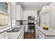 Kitchen with stainless steel appliances, a window, recessed lights and granite countertops at 3363 Morelyn Crest Cir, Orlando, FL 32828