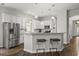 Bright kitchen features stainless steel appliances, subway tile backsplash, and granite countertops at 3363 Morelyn Crest Cir, Orlando, FL 32828