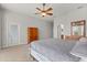Large primary bedroom featuring neutral paint, a ceiling fan, carpet, and a king-sized bed at 3363 Morelyn Crest Cir, Orlando, FL 32828