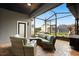 Screened patio with comfortable seating and stylish brick flooring for outdoor relaxation at 3363 Morelyn Crest Cir, Orlando, FL 32828