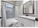 Cozy bathroom featuring a shower with tile surround, and a vanity with granite countertop at 3618 Pompano Ct, Gotha, FL 34734