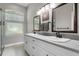 Bright bathroom features a double sink vanity, natural light and modern fixtures at 3618 Pompano Ct, Gotha, FL 34734