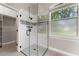 Elegant bathroom with a glass enclosed shower and a walk-in closet at 3618 Pompano Ct, Gotha, FL 34734