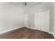 This bedroom showcases hardwood floors, a closet, and a ceiling fan at 3618 Pompano Ct, Gotha, FL 34734