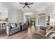 Spacious living area featuring hardwood floors and neutral paint with an open view into the dining room and kitchen at 3618 Pompano Ct, Gotha, FL 34734