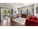 Inviting living room with hardwood floors, and a sliding glass door to the patio at 3618 Pompano Ct, Gotha, FL 34734