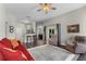 Bright living room with hardwood floors, ceiling fan, and open floor plan at 3618 Pompano Ct, Gotha, FL 34734