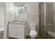 Clean bathroom features a single sink vanity, a shower, and updated fixtures at 3994 Knott Dr, Apopka, FL 32712