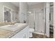 Modern bathroom featuring granite counters and a glass-enclosed shower at 3994 Knott Dr, Apopka, FL 32712