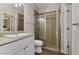 Modern bathroom with a granite-topped vanity and a glass-enclosed shower at 3994 Knott Dr, Apopka, FL 32712