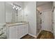 Bathroom vanity with stone counters, tile backsplash, and modern fixtures at 3994 Knott Dr, Apopka, FL 32712
