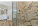 Primary bathroom featuring marble tile shower and modern soaking tub at 3994 Knott Dr, Apopka, FL 32712
