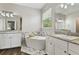 Bright bathroom featuring a soaking tub, granite counters, and modern fixtures at 3994 Knott Dr, Apopka, FL 32712
