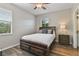 Bedroom featuring a ceiling fan, a window letting in natural light, and wood floors at 3994 Knott Dr, Apopka, FL 32712