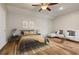 Bedroom boasts wood floors, modern decor, and a relaxing seating arrangement at 3994 Knott Dr, Apopka, FL 32712