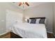 A spacious bedroom with a large bed, closet and neutral paint scheme at 3994 Knott Dr, Apopka, FL 32712