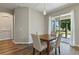 Dining area with wooden table, upholstered chairs, and sliding glass door to the backyard at 3994 Knott Dr, Apopka, FL 32712