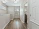 Hallway with natural light, wood floors, and white trim, creating an inviting transition space at 3994 Knott Dr, Apopka, FL 32712