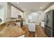 Well-lit kitchen featuring granite countertops, stainless steel appliances, white cabinets, and a central island at 3994 Knott Dr, Apopka, FL 32712