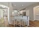 Bright kitchen featuring a breakfast bar with seating and stainless steel appliances at 3994 Knott Dr, Apopka, FL 32712